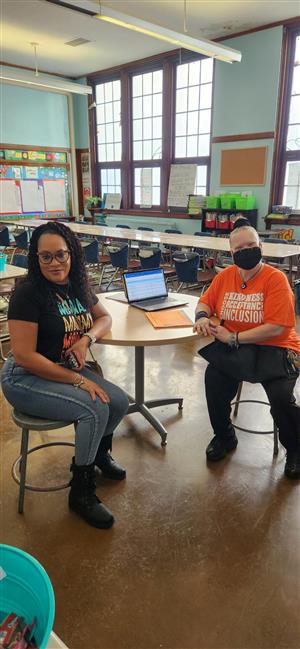 Parent speaks with teacher